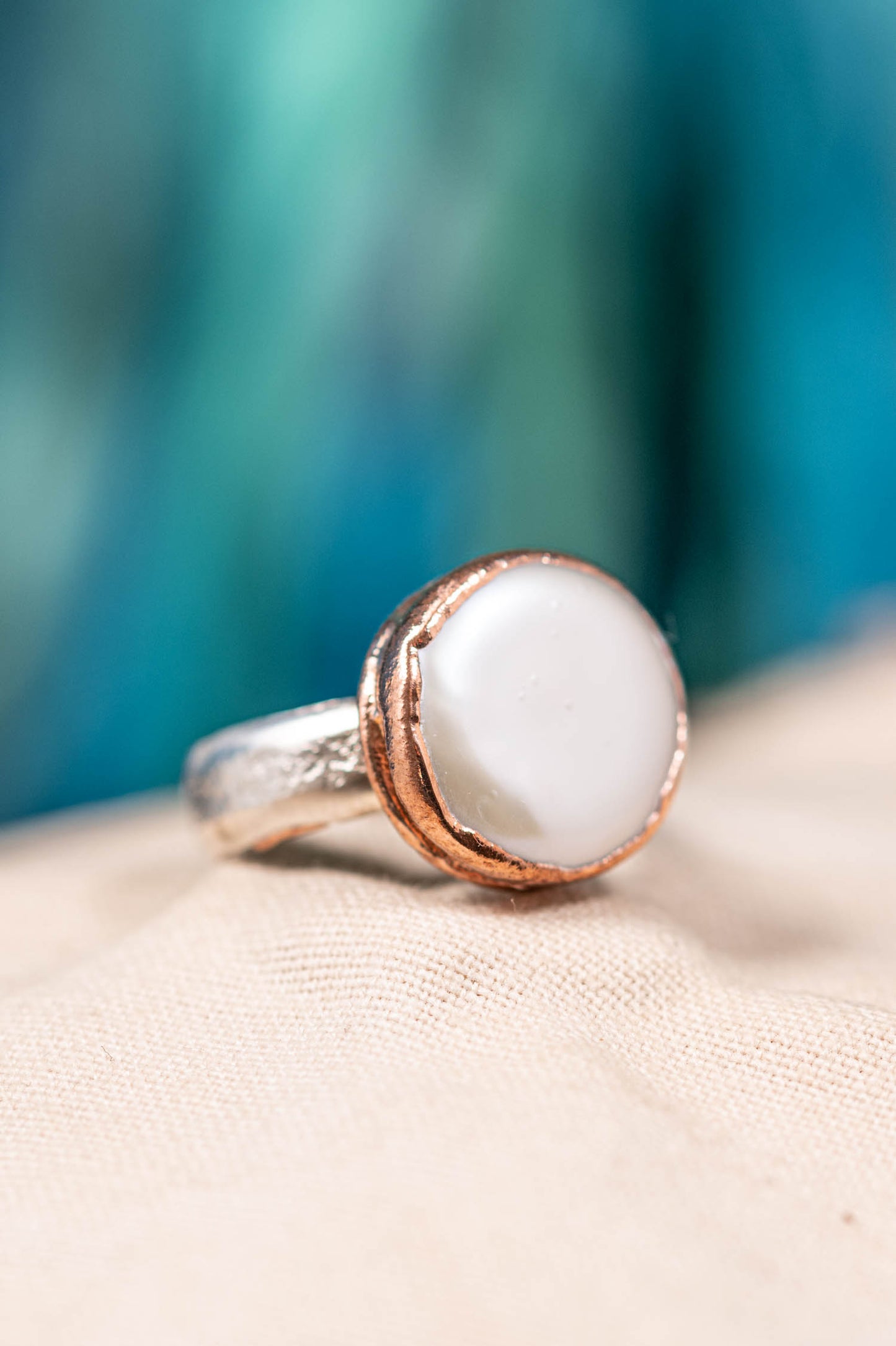 silver and copper pearl ring